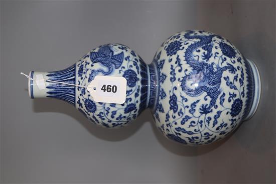 A Chinese blue and white dragon and phoenix double gourd vase , Qianlong mark but late 19th/early 20th century, H. 35.cm